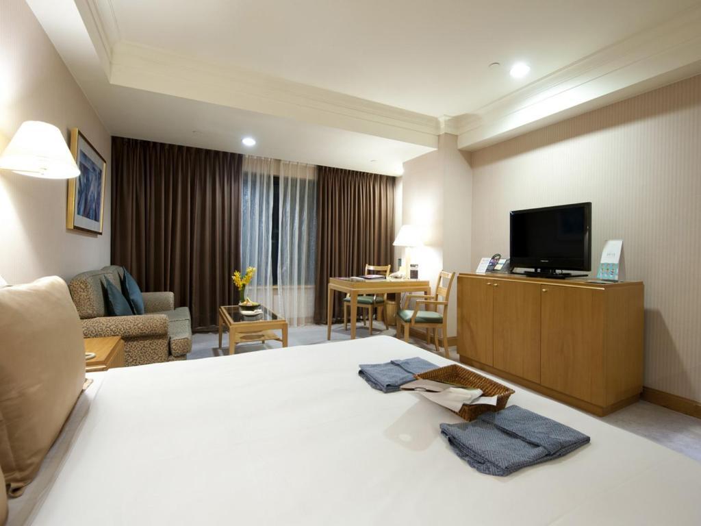 85 Sky Tower Hotel Kaohsiung Bilik gambar A typical room at the hotel